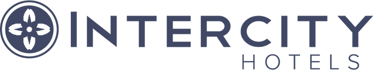 The Intercity Hotels logo features a circular emblem with four petal-like shapes on the left, symbolizing innovation, and the words INTERCITY HOTELS in bold uppercase letters on the right — ideal for brands using Revenue Management Software.